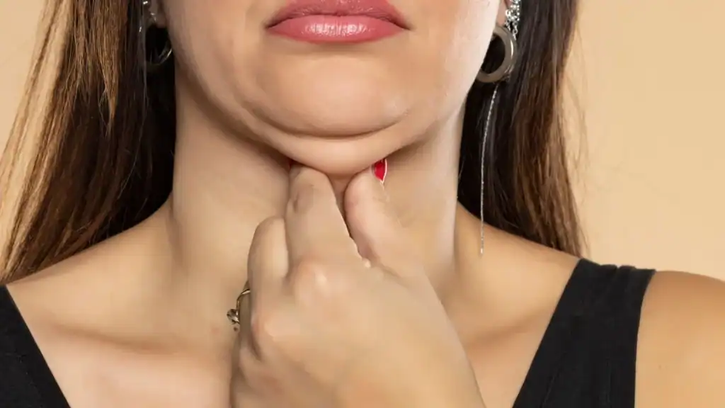 An image of a woman with double chin, sad, worried : Non Surgical Double Chin Removal Treatment in Westwood, UK